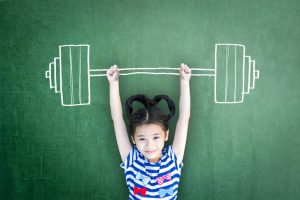 a girl carrying chalk weights